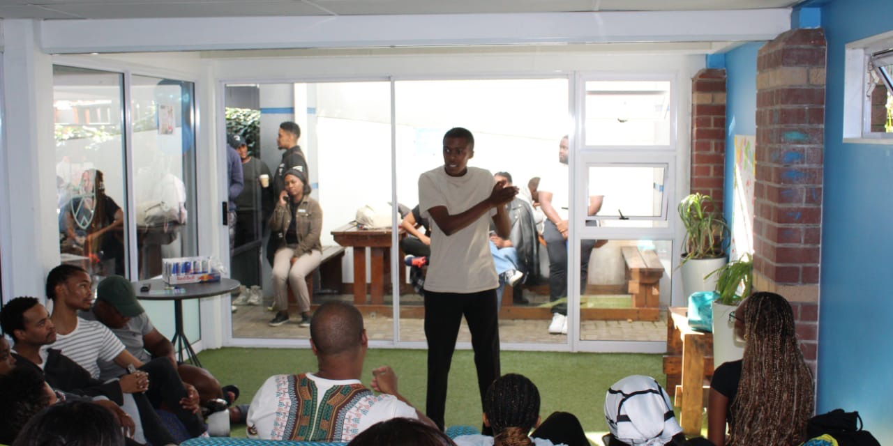 Cwenga Sihle Peter speaking to an engaged audience